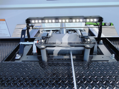 Trailer hitch mechanism with a LED light bar mounted on a metal platform, view from top.