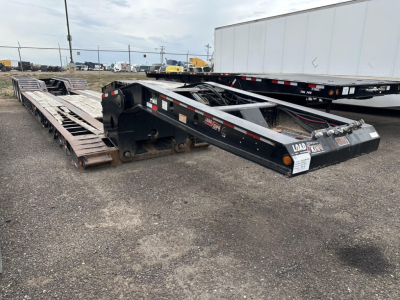 Load King RGN Lowboy trailer showing flatbed sections and gooseneck hitch from right side view.