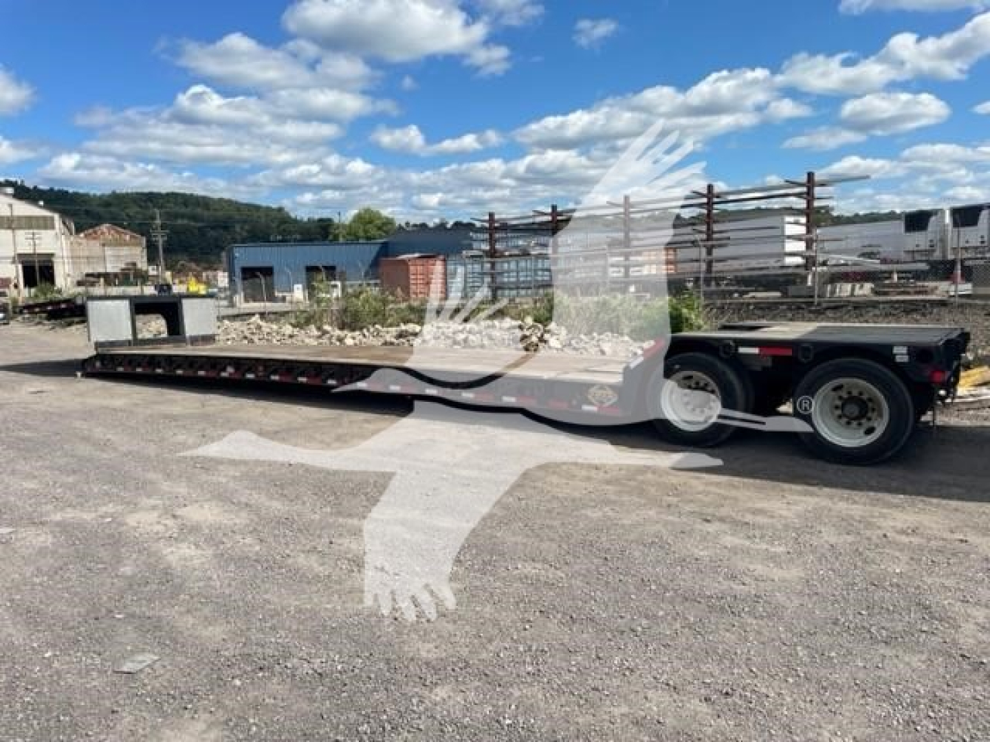Fontaine Renegade LXT-40 trailer with double drop expandable configuration, flatbed low bed, shown in yard.