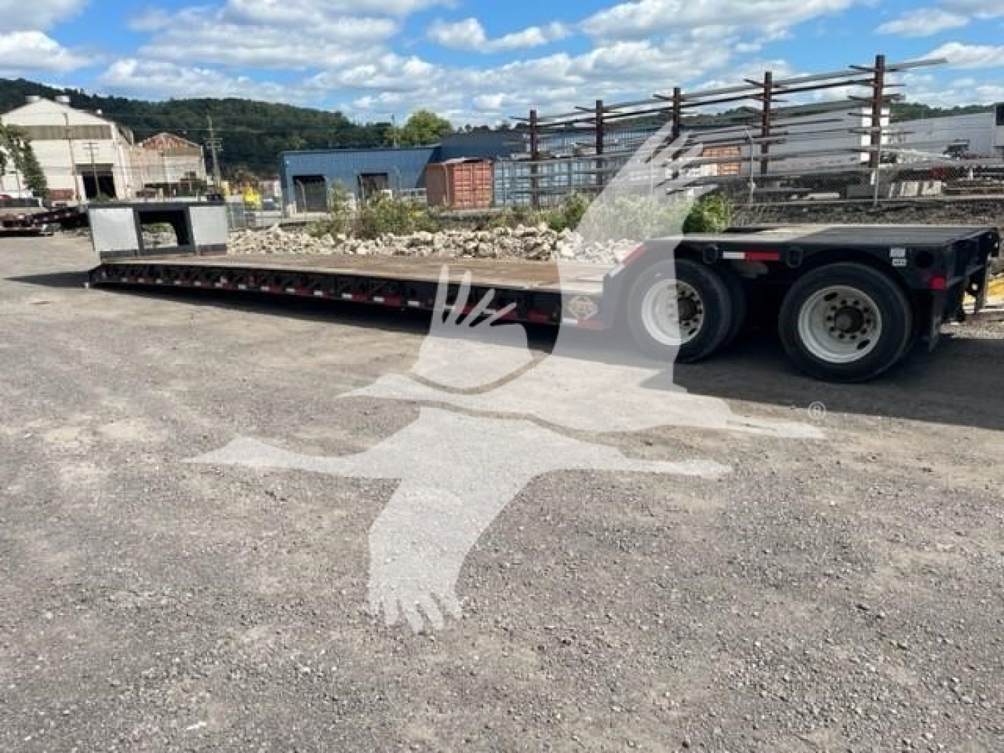 Fontaine Renegade LXT-40 trailer in-service showing long low-bed deck and tandem axles.