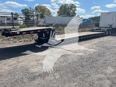  Fontaine Renegade LXT-40 trailer with low bed, dual drop gooseneck, flatbed deck. visible label on side reads Fontaine branding and model. overall view shows wheels and rear equipment. 