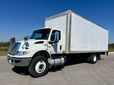 Box truck with a white cab and aluminum cargo box. Visible text includes 'LIMITED' on the cargo box and '7151' on the door. No other legible labels or numbers readable.