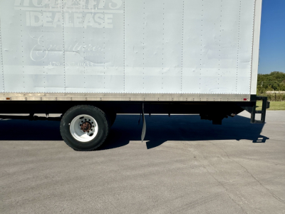 Box truck side view showing wheel and undercarriage of a 2023 International MV607 with stock number 0634233 and VIN 1HTEUMML4PH870757.