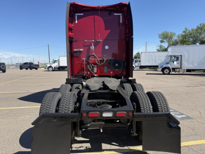 Peterbilt 579 truck rear view showing fifth wheel and dual rear wheels in a parking lot.