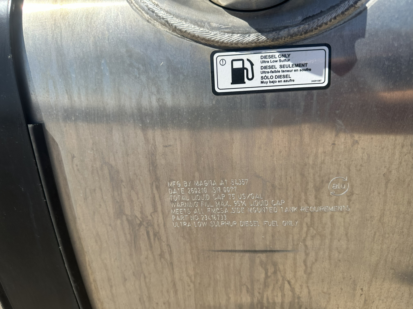 Mack AN64T truck fuel/label area showing Diesel Only sticker and embossed text on metal panel.