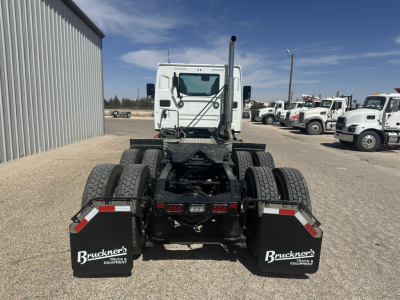 Mack AN64T front/rear view showing chassis and dual rear axles with mudflaps and Bruckner's equipment logos.