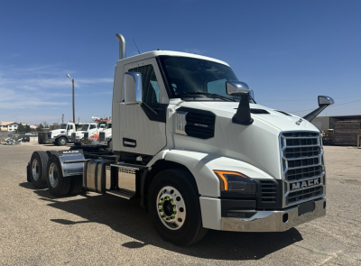 Truck side view showing 2027 Mack AN64T conventional daycab with chrome grille and dual rear axles.