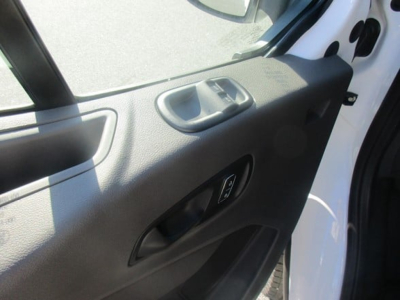 Ford Transit cargo van interior door panel with window controls in view.