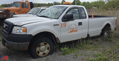 Ford F-150 XL pickup truck in driveable condition with orange roadside numbers and state highway logo on door.