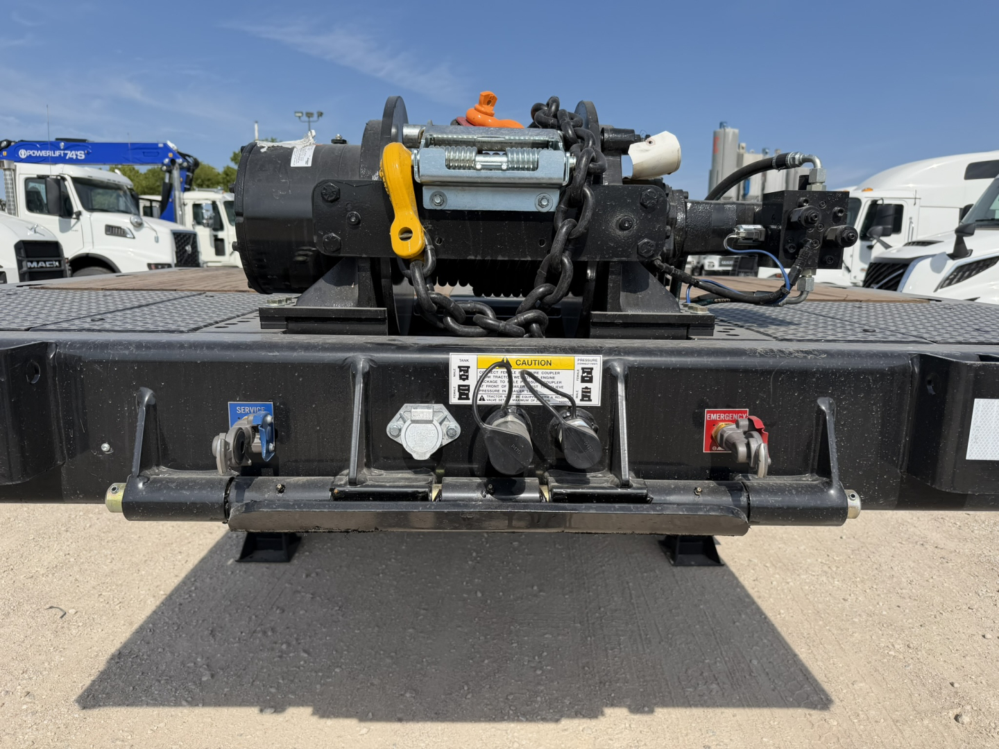 Front view of Landoll 455B-53 traveling axle trailer hitch assembly with manual crank, hydraulic components, and safety latches.
