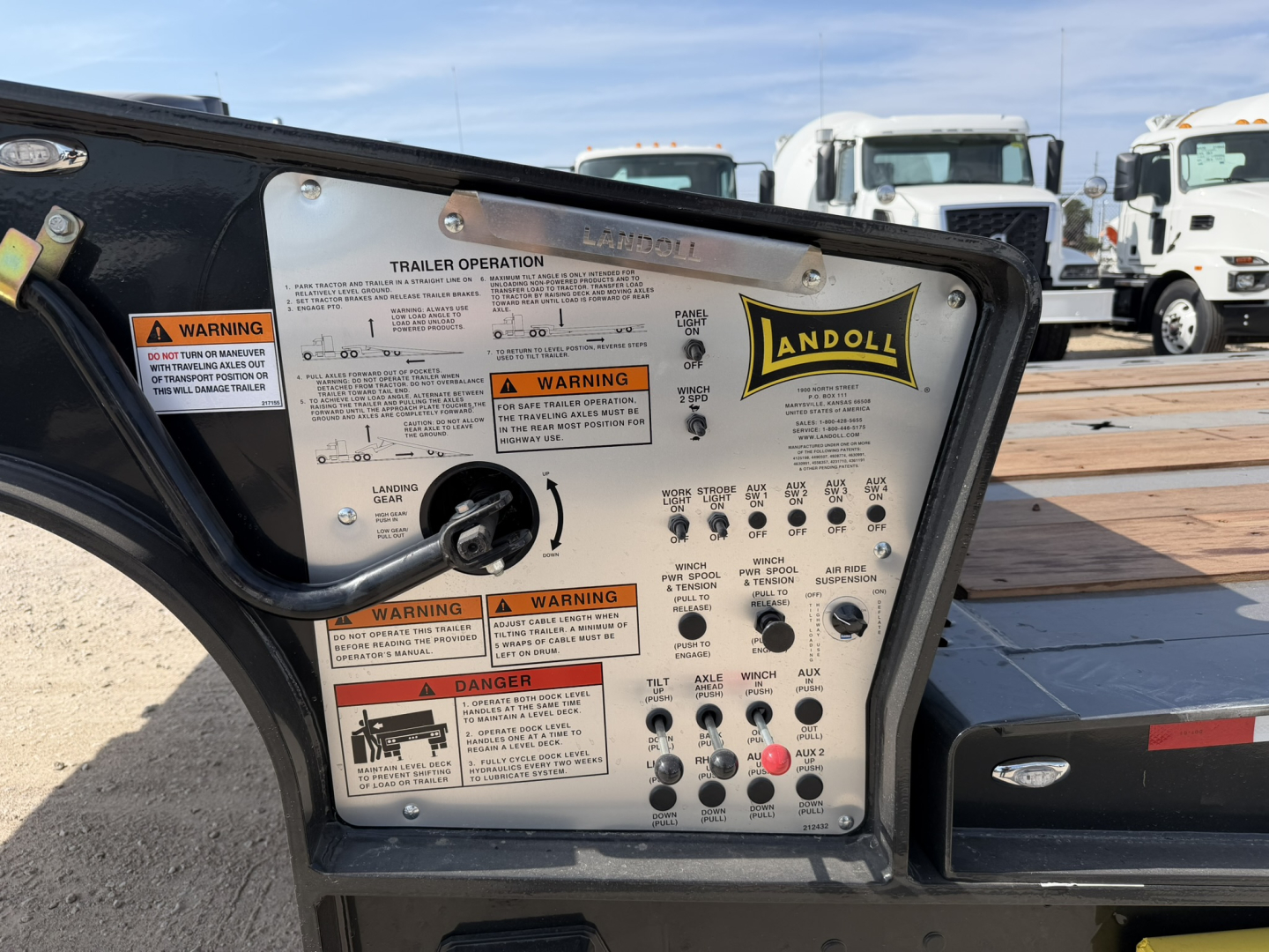 Landoll 455B-53 trailer control panel with warning labels and stickers visible