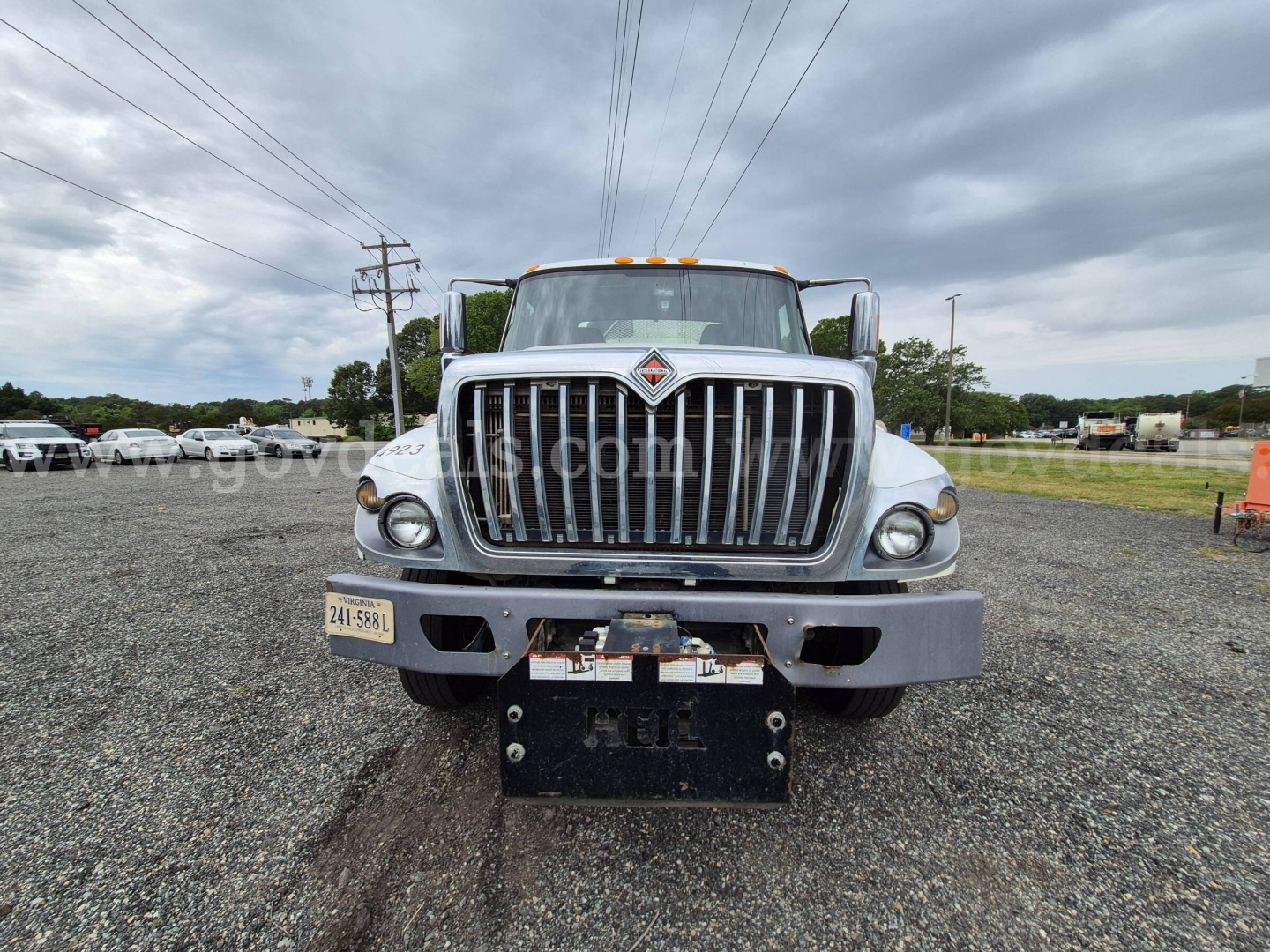 Front view of 2017 International 7400 garbage truck showing grille, headlights, and bumper with license plate area