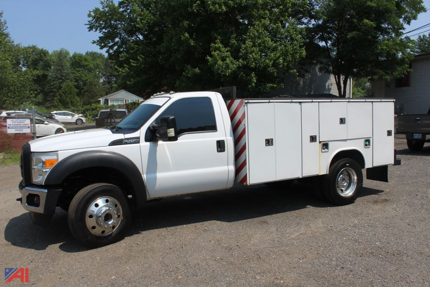 Ford F-550 Super Duty utility truck in white with service body and storage compartments