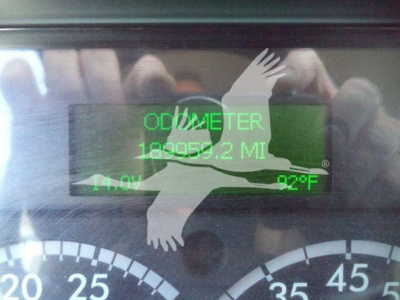 Freightliner M2 dash display showing odometer reading and digital gauges with green text, front view partial gauge cluster