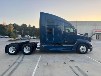 Kenworth T680 sleeper cab tractor in blue, side view, 6x4 configuration with dual rear axles, VIN 1XKYD49X4RJ333053, stock 0631524.