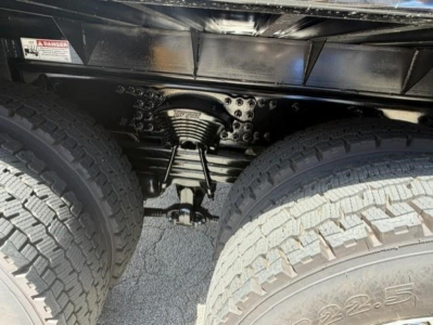 Western Star 47X chassis view showing rear suspension with tandem axle and leaf springs between dual tires.