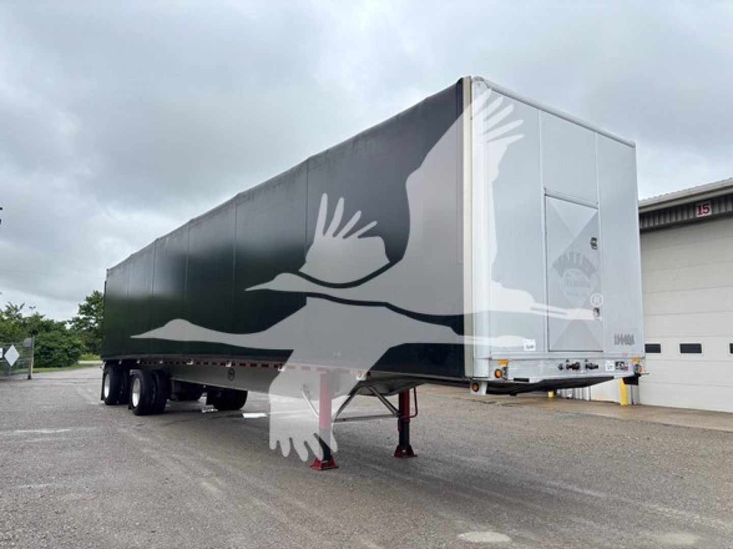 Curtainside trailer showing side graphics and rear door, 2013 Mac Road Warrior, VIN 5MAPA4824DA024951, stock 7690