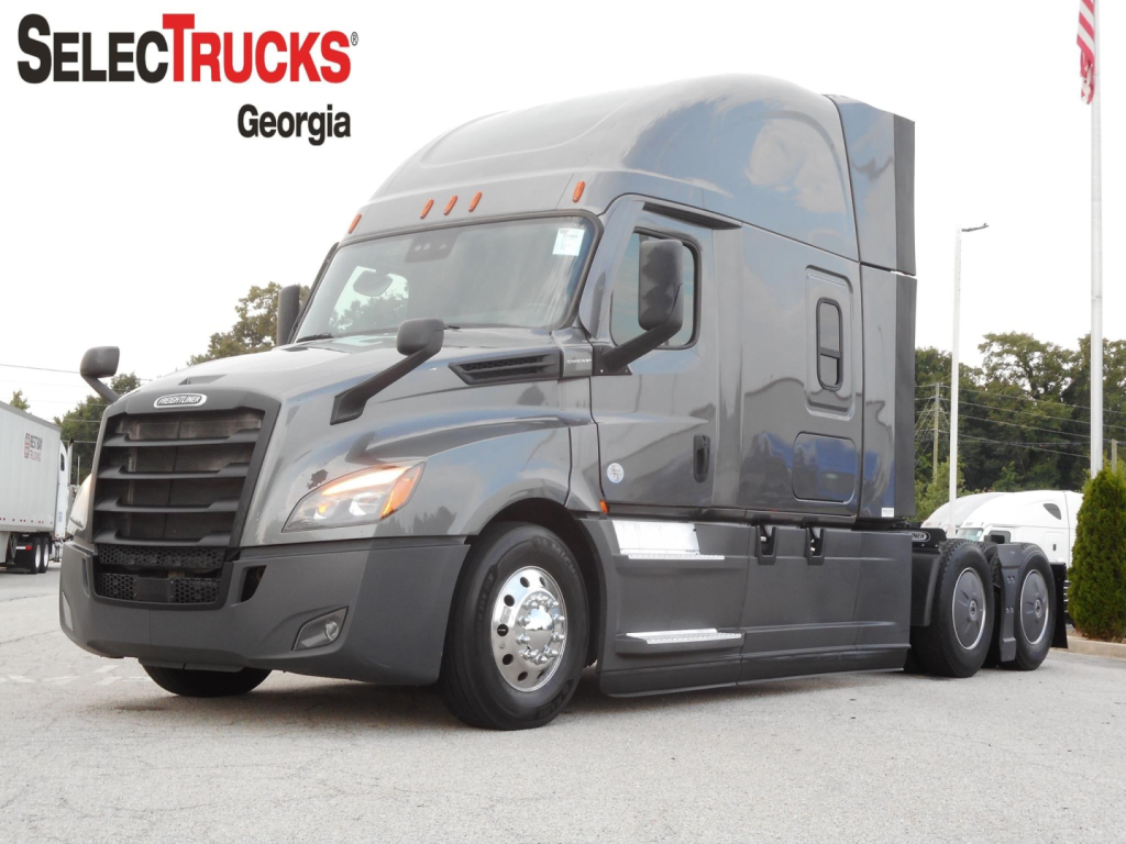 Tractor-trailer tractor cab with Freightliner-style grille in front, side windows, and sleeper cab; SelectTrucks Georgia watermark and a 2022 Freightliner Cascadia 126 listing context visible.