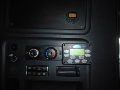 Truck dashboard panel showing climate controls and digital display in Freightliner Cascadia cab.
