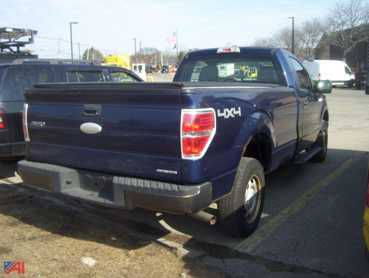 Ford F-150 pickup truck 4x4 rear view with tailgate and 4x4 badge visible.