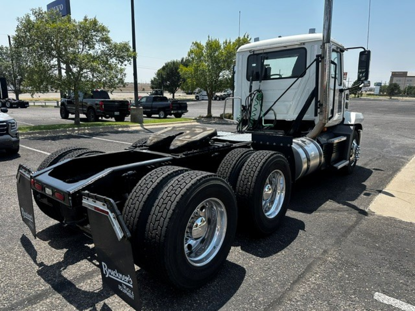 Truck chassis of a 2020 Mack ANTHEM daycab showing rear dual axles and fifth wheel area.
