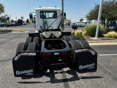 Truck view showing rear of a 2020 Mack ANTHEM daycab tractor with dual rear axles, mud flaps labeled Bruckner’s Equipment, and fifth wheel area visible.