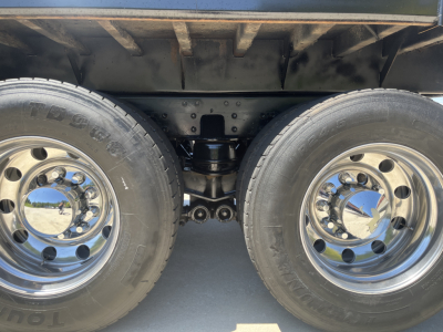 Kenworth T800 rear dual axle truck wheels and suspension undercarriage view showing twin tires and chrome rims