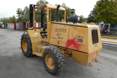 Master Craft C06-10116 truck-mounted forklift in service bay showing 7833 serial label and C-series branding