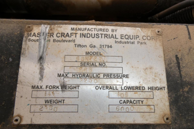 Master Craft Industrial Equipment tag showing model, serial, max hydraulic pressure, max fork height, overall lowered height, weight, and capacity.