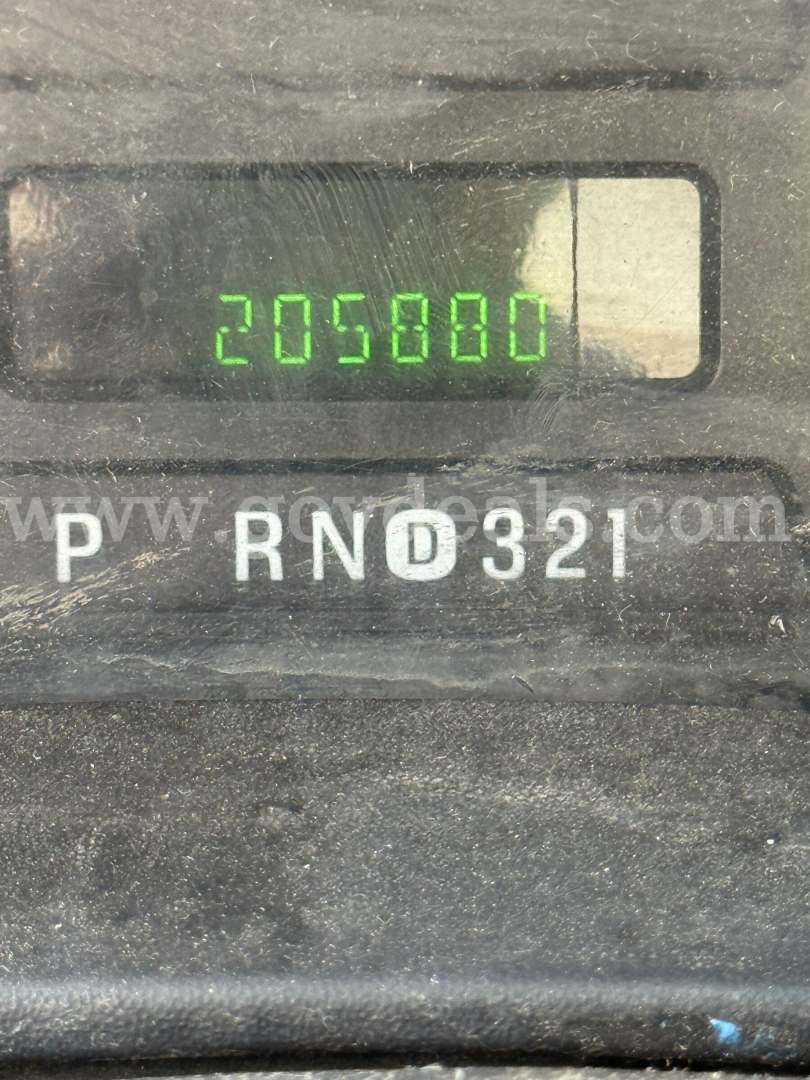 Dashboard odometer reading 205,800 miles and gear selector PRND321 on a Ford F-550 instrument panel.