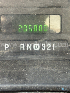 Dashboard odometer reading 205,800 miles and gear selector PRND321 on a Ford F-550 instrument panel.