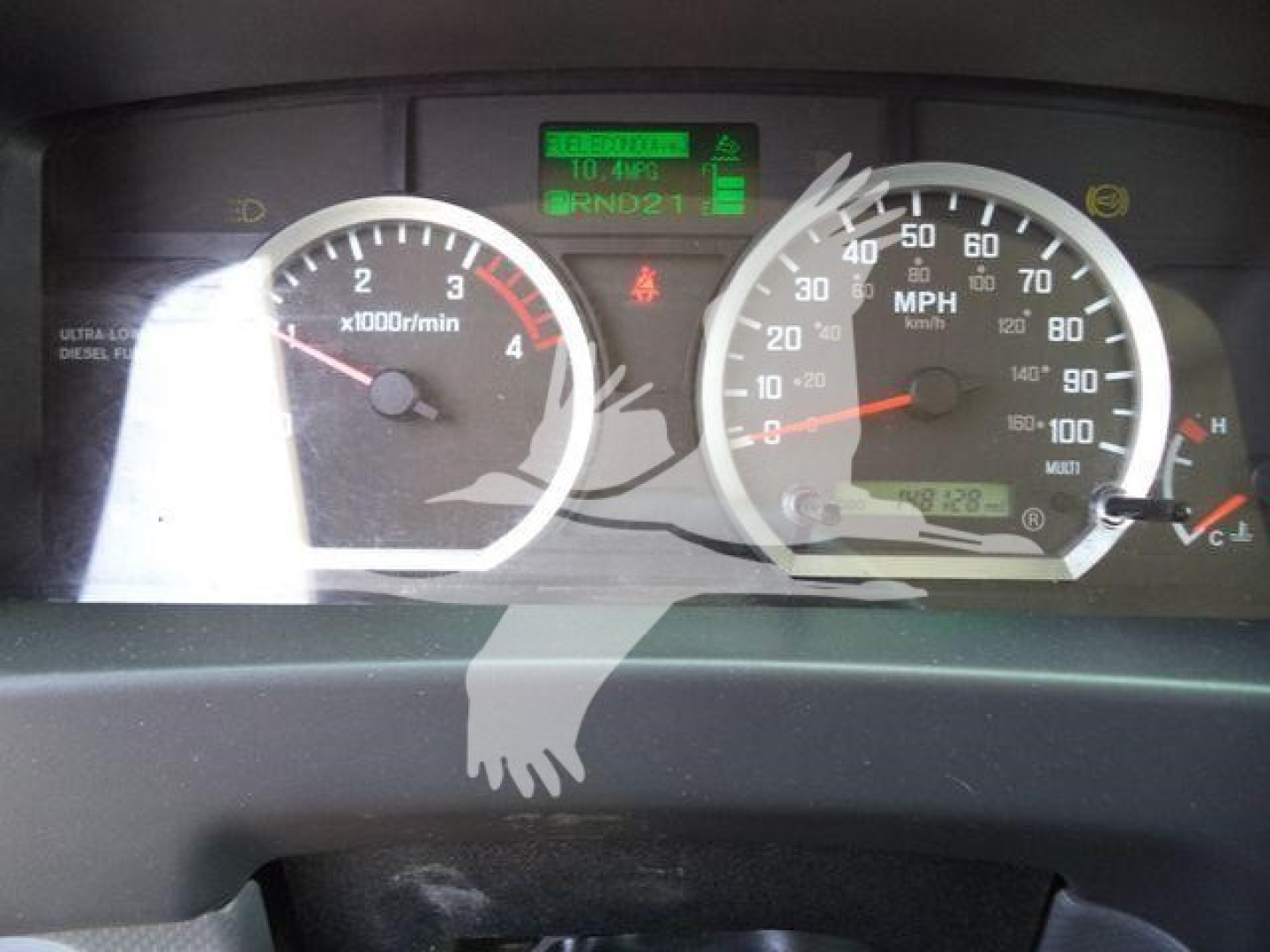 Isuzu NPR/NRR instrument cluster showing tachometer and speedometer with green digital display and warning icons