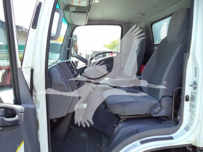 Isuzu NPR truck cab interior with front seats, steering wheel, and dashboard viewed from open driver door.