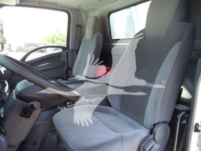 Isuzu NPRR cab interior showing two grey fabric seats and steering column.