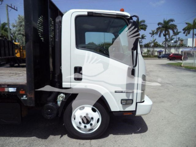 Isuzu NRR cab near side showing front wheel and part of flatbed dump body.