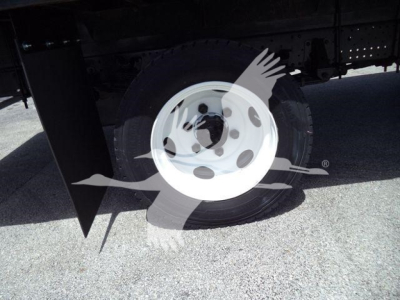 Isuzu NRR wheel and undercarriage view showing front wheel and partial chassis