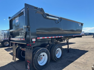 Ranco Anvil Steel quarter-frame end dump trailer with elliptical dump body and dual rear axles, side view showing black finish and rear taillights.