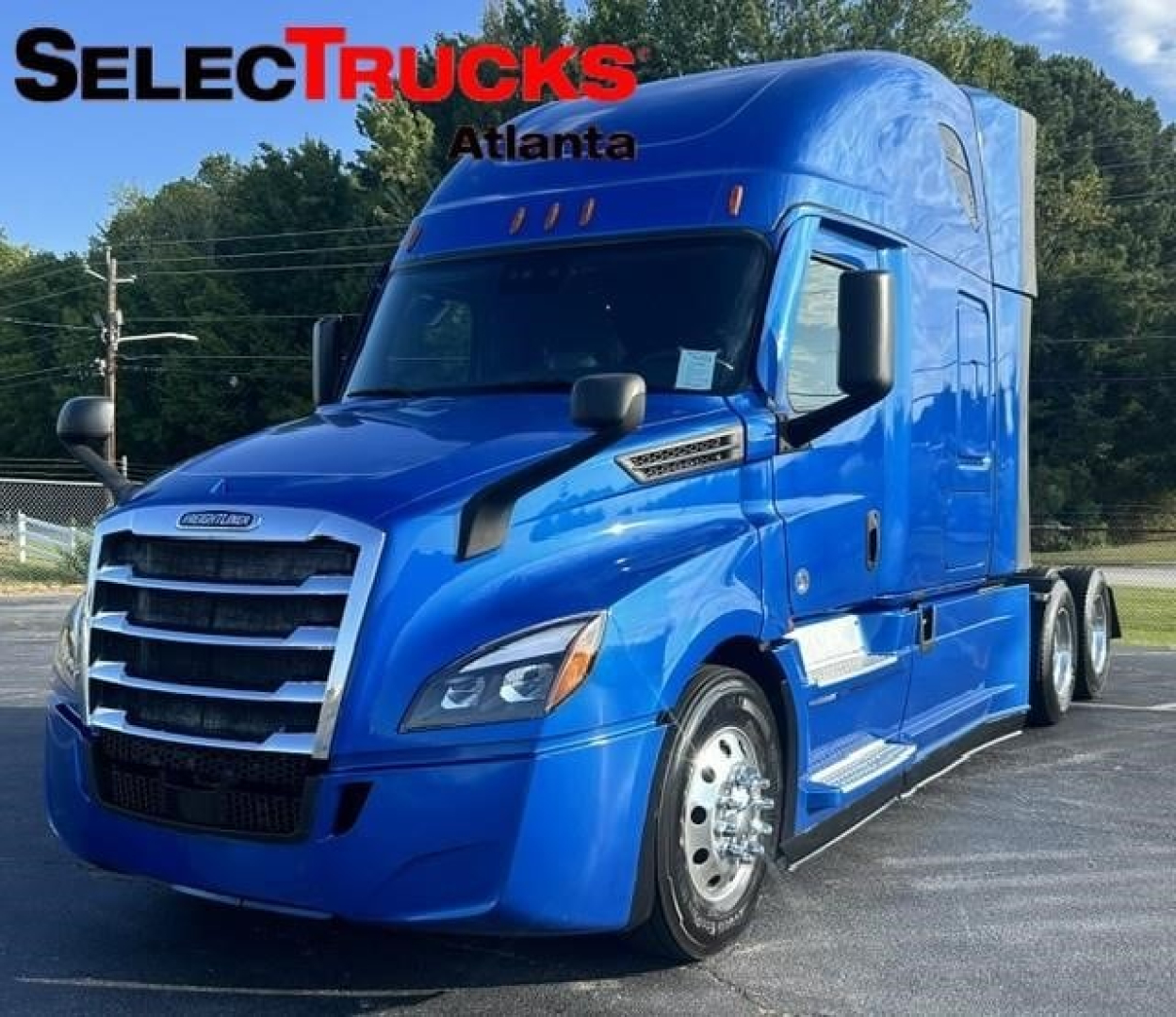 Truck cab showing a blue Freightliner Cascadia 126 sleeper with chrome grille and black mirrors; SelectTrucks Atlanta watermark on windshield; VIN and stock info not visible on image.