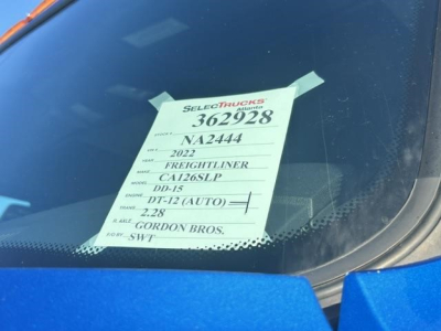 Foremost tag on windshield showing stock number 362928, VIN partially 3AKJHHDR9NSNA2444, 2022 Freightliner Cascadia 126, CA136SLP, engine details, and Gordon Bros. formatting.