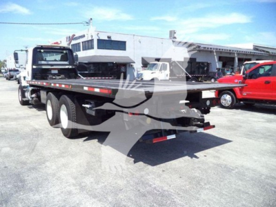 Flatbed tow truck trailer with dual rear axles visible, International Workstar 7600 model in background, VIN 3HAGSSNT6GL226270 not visible on image but listed in data.