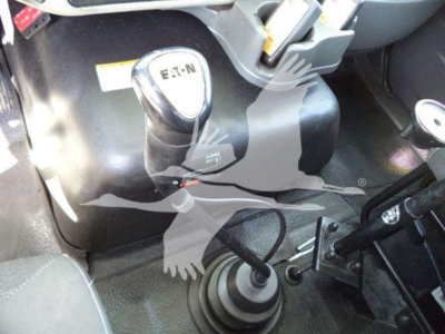 Gear shift lever and cab floor of a 2016 International Workstar 7600 truck showing automatic or manual transmission gear selector with nearby pedals and interior