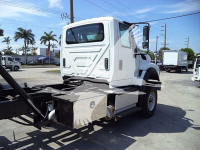 1966 International Workstar 7600 rollback truck cab and chassis side view showing auxiliary aluminum toolbox and chassis components.