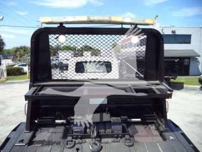 Trucker's rollback bed showing rear cab area with mesh guard and cargo bed, International Workstar 7600 image.