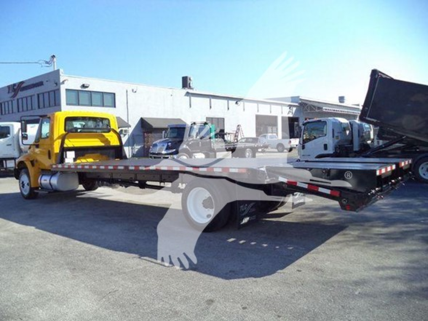 2019 International 4300 auto carrier tow truck with flatbed in yard, VIN 3HAMMMML6KL383445, stock T83445, used
