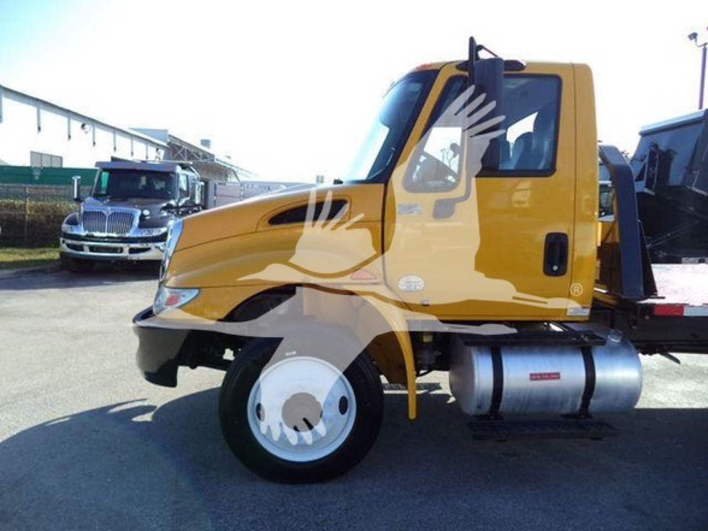 2019 International 4300 auto carrier truck side view showing cab and fuel tank