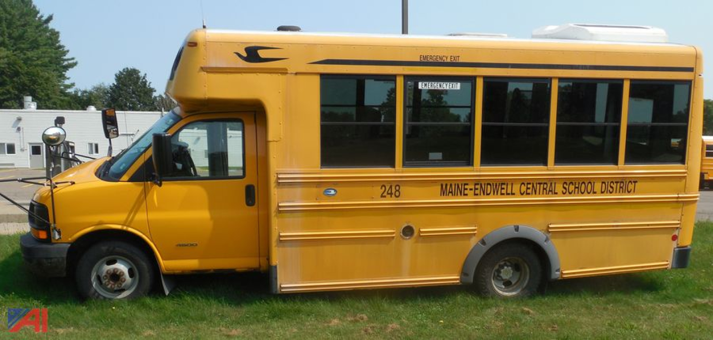 School bus side view showing 2012 Express Micro Bird with wheelchair lift, yellow body, Maine-Endwell Central School District markings.