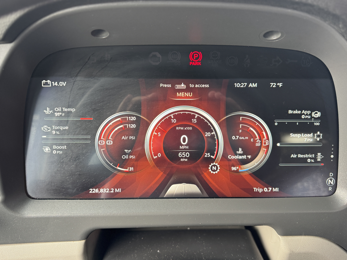 Peterbilt 579 digital instrument cluster display showing gauges for oil temp, torque, Boost, oil psi, coolant temp, trip miles, and gear indicators. Visible text includes 14.0V, 10:27 AM, 72°F, PARK indicator, 0 MPH, 650 RPM, 226,832.2 MI,