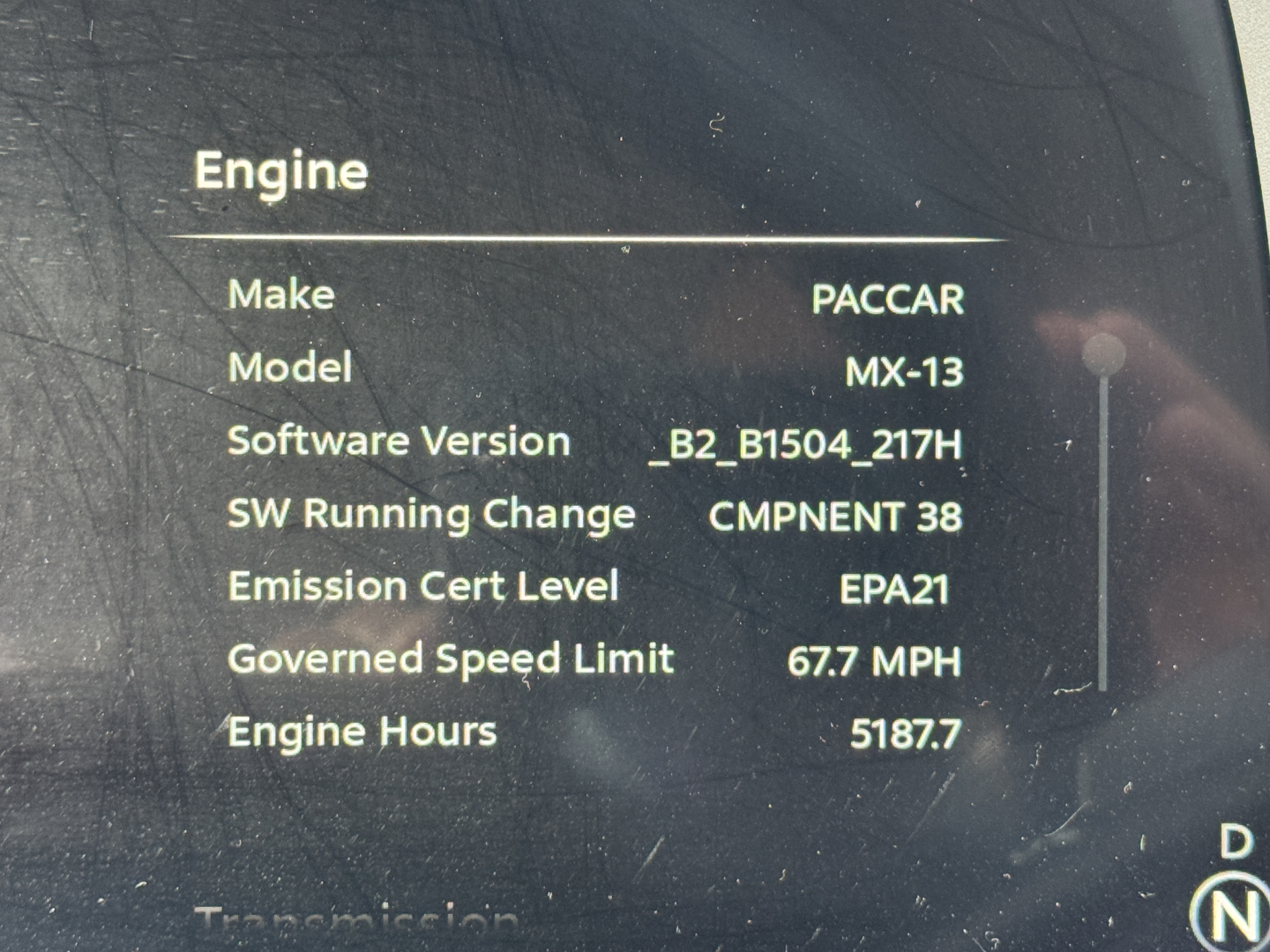 Engine display in Peterbilt 579 showing Make: PACCAR, Model: MX-13, Software Version _B2_B1504_217H, Emission Cert Level EPA21, Goverened Speed Limit 67.7 MPH, Engine Hours 5187.7, SW Running Change CMPNENT 38.