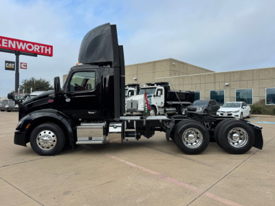 2022 Peterbilt 579 conventional daycab truck side view displaying cab, chassis, and dual rear axles.