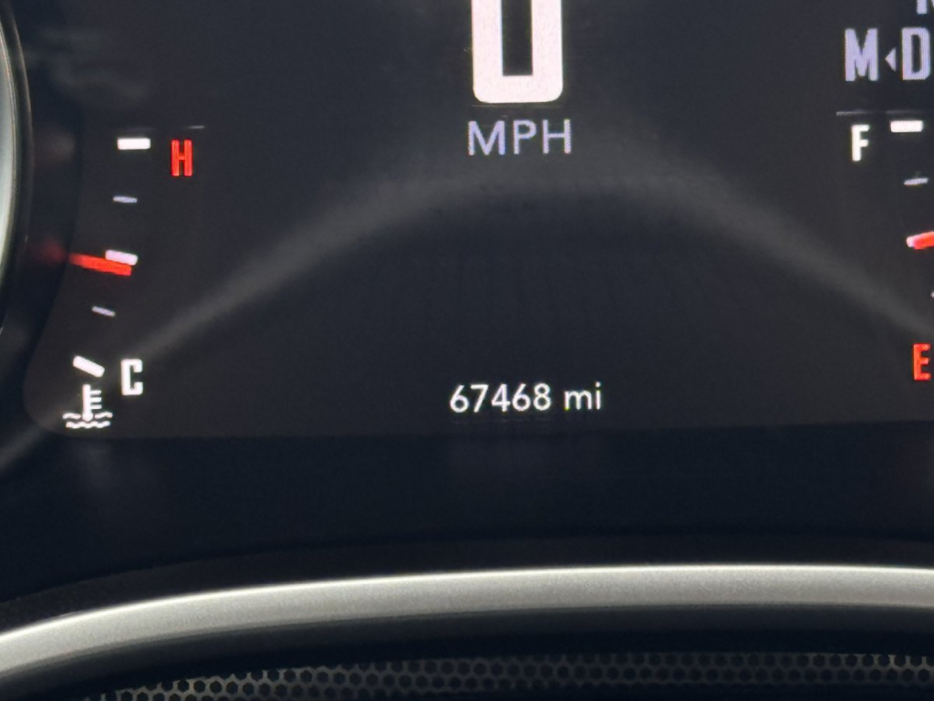 Dodge Challenger dashboard showing 67468 miles displayed on odometer and speedometer with 'MPH' label.